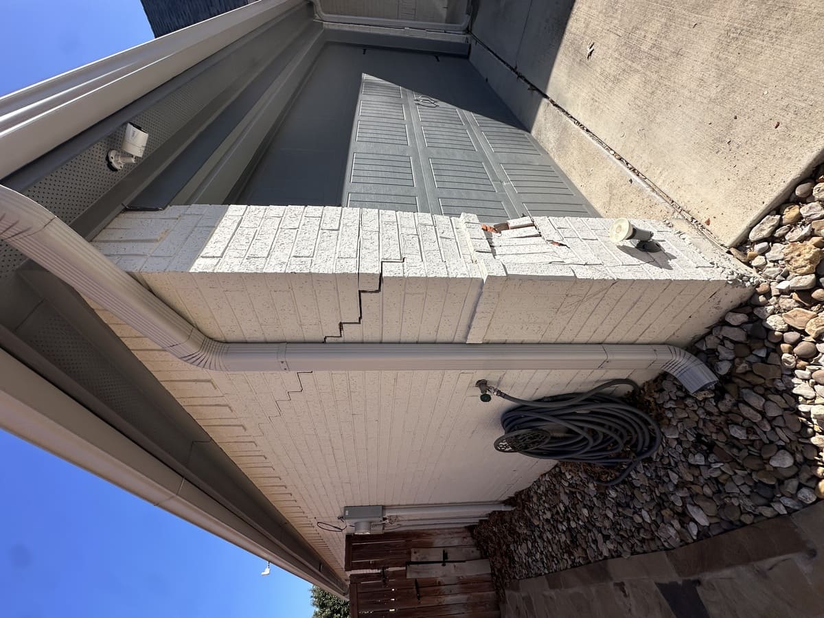 Salt deposits and moisture damage on brick in White Settlement TX — efflorescence requiring professional masonry cleaning and treatment