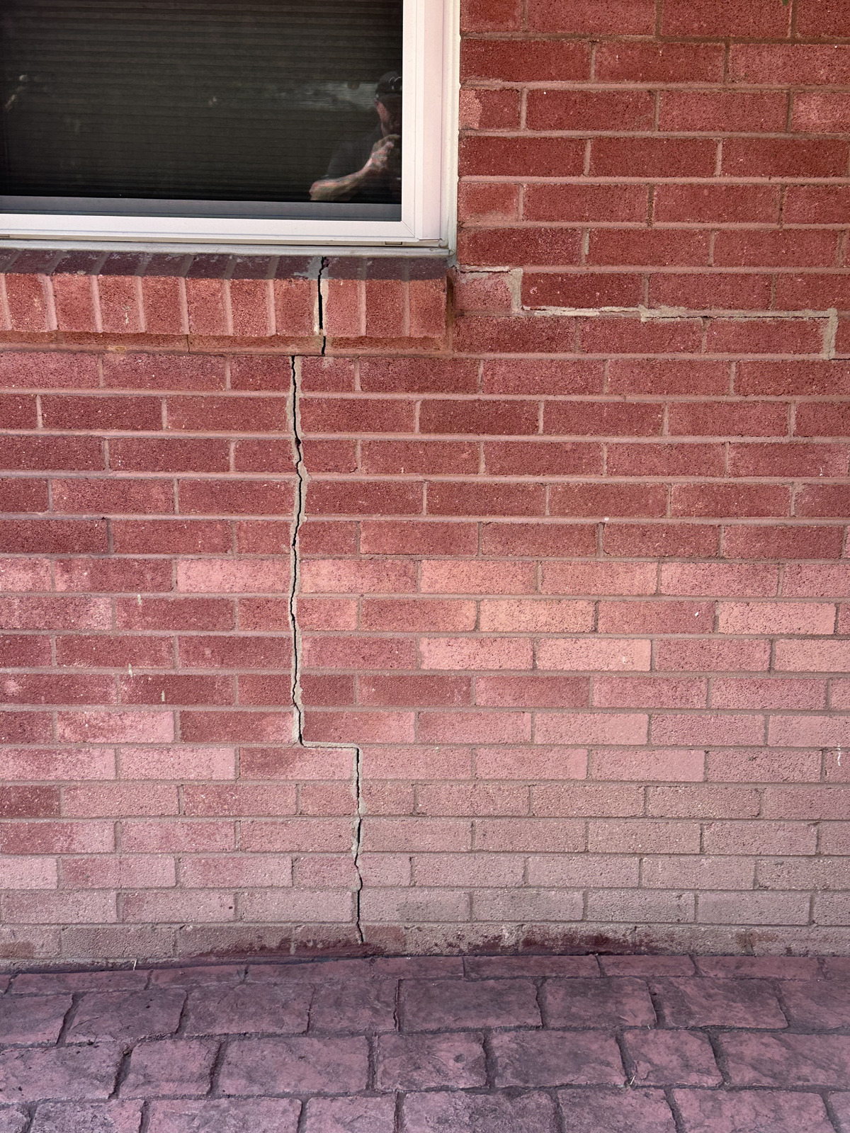 Stair-step mortar cracks caused by Texas clay soil in Fort Worth home