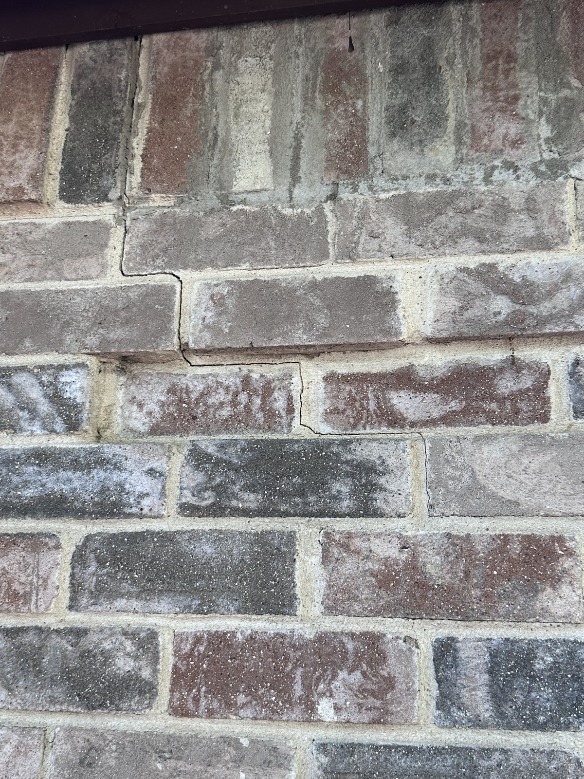 Mortar cracking from foundation stress on Fort Worth home – masonry restoration repair of structural damage by expert contractors