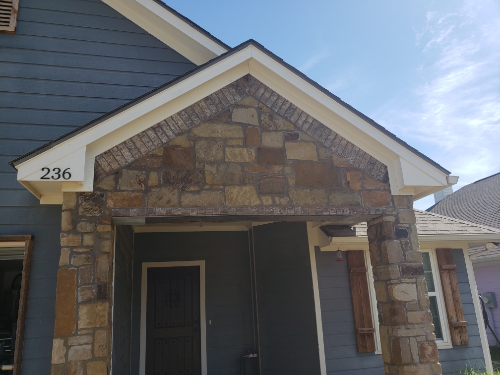 Structural brick and stone arch replacement with steel lintel in Fort Worth entryway – professional masonry support installation